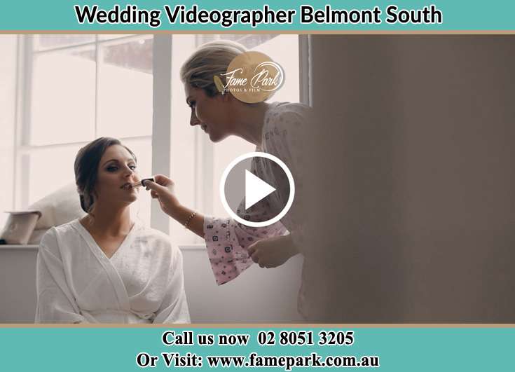 The Bride having a make-up with the help of the makeup artist Belmont South NSW 2280