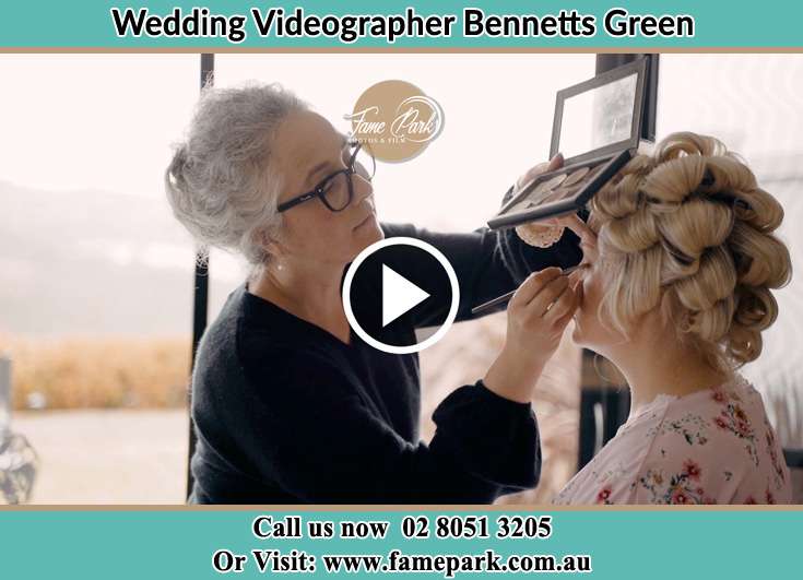 The Bride having a make-up with the help of the makeup artist Bennetts Green NSW 2290