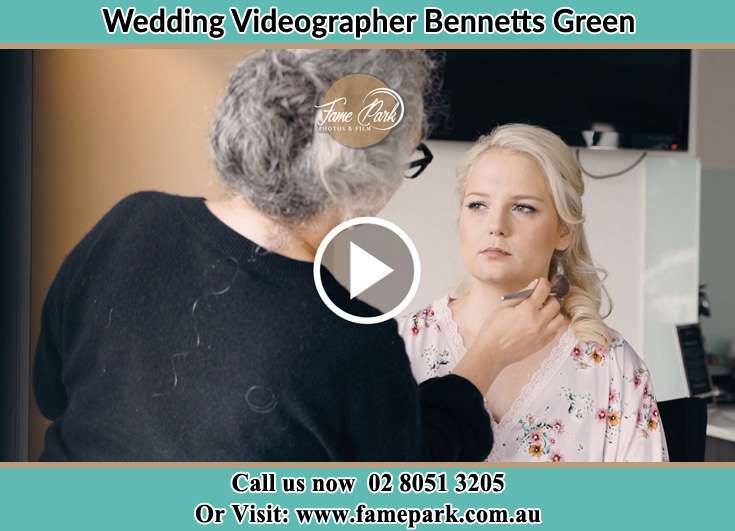 The Bride having a make-up with the help of the makeup artist Bennetts Green NSW 2290