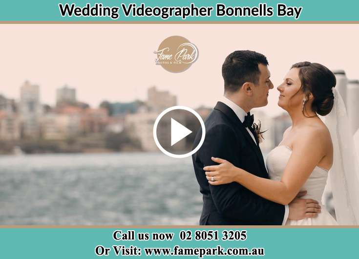 Bride and Groom kissed at the shore Bonnells Bay NSW 2264