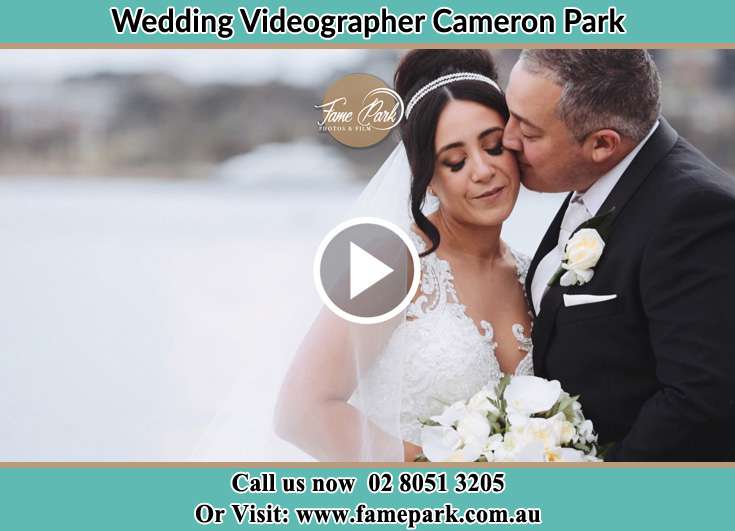 Bride and Groom kissed at the shore Cameron Park NSW 2285