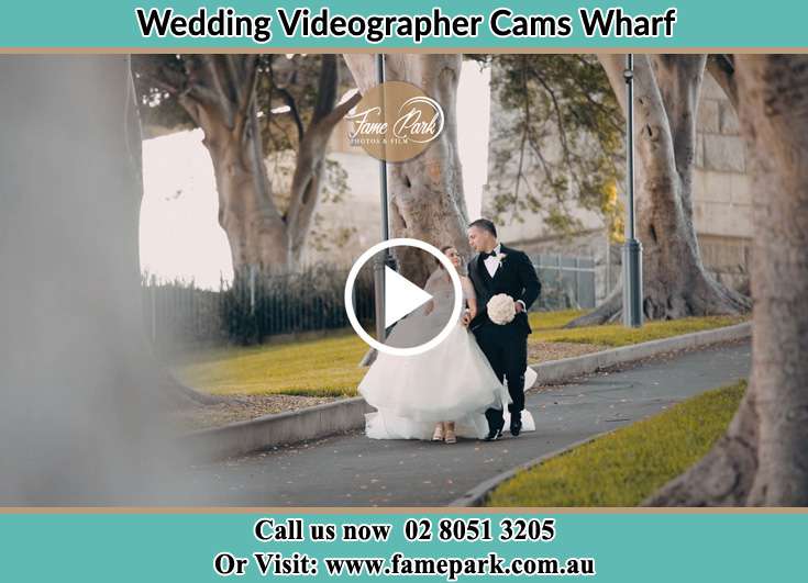 The Groom and the Bride walking in the street Cams Wharf NSW 2281