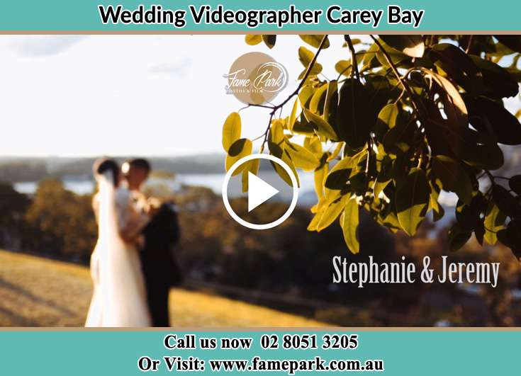 The new couple kissing at the hill Carey Bay NSW 2283