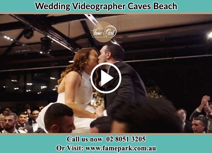 The newly weds kissing Caves Beach NSW 2281