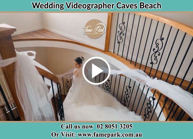 The Bride walking downstairs Caves Beach NSW 2281