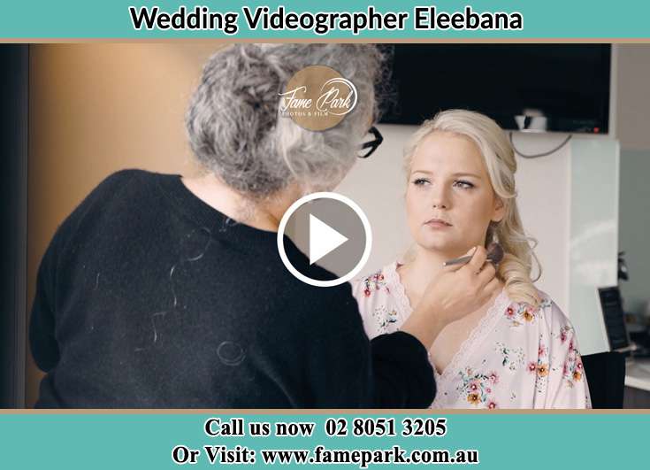 The Bride having a make-up with the help of the makeup artist Eleebana NSW 2282