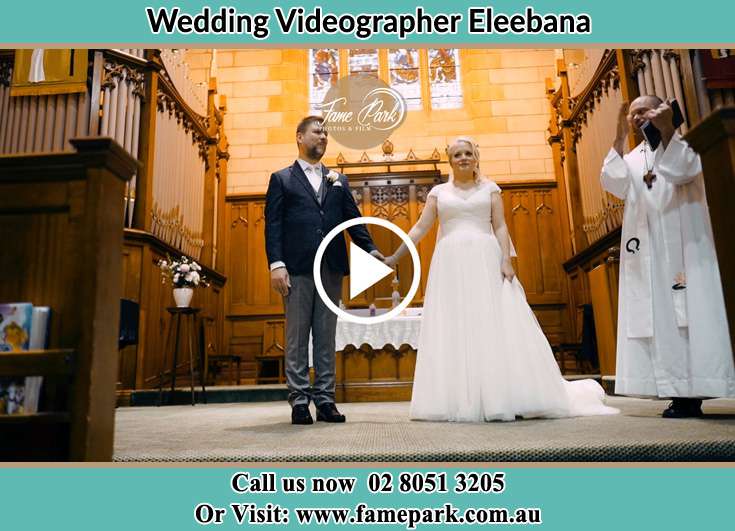 Bride and Groom at the altar with the Priest Eleebana NSW 2282