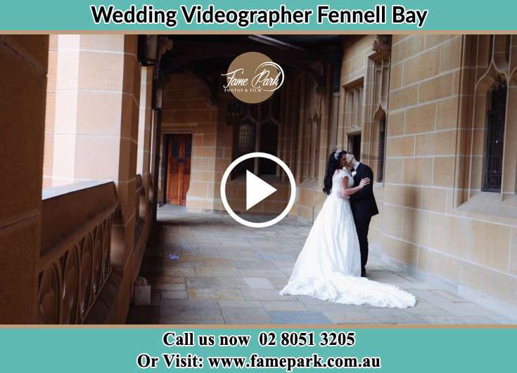 The newly weds kissing at the hall way Fennell Bay NSW 2283