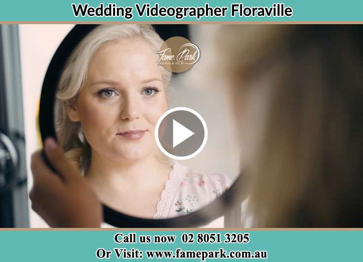 Bride getting ready in front of the mirror Floraville NSW 2280