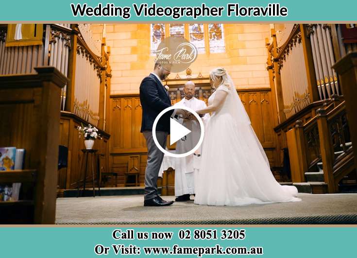 Bride and Groom at the altar with the Priest Floraville NSW 2280