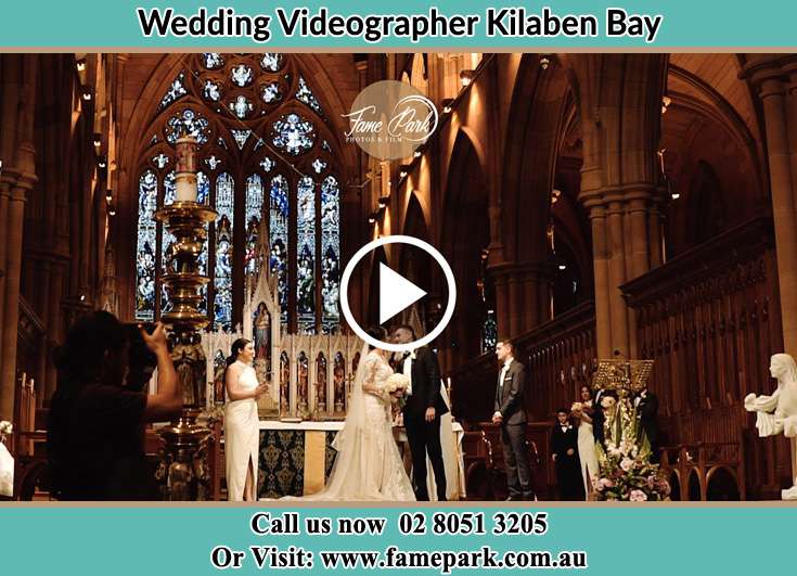 The Bride and the Groom kissing at the altar Kilaben Bay NSW 2283