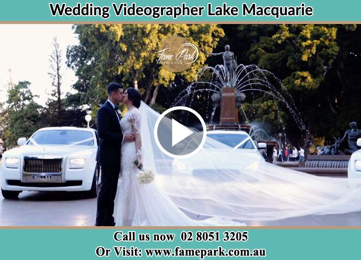 The Bride And Groom Kiss In Front Of The Bridal Car Lake Macquarie