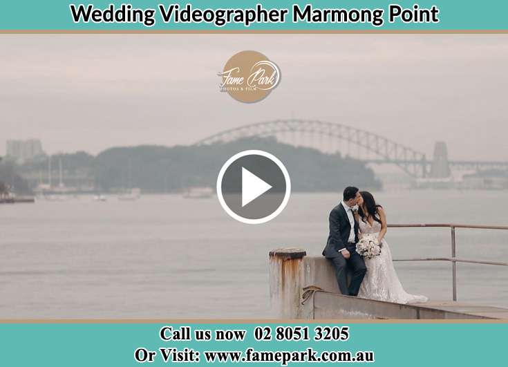 Bride and Groom kissed at the shore Marks Point NSW 2280