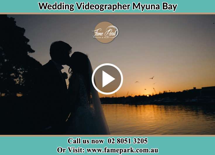 Bride and Groom kissed at the shore Myuna Bay NSW 2264