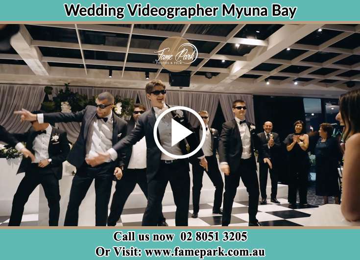 Groom and his secondary sponsors dancing Myuna Bay NSW 2264