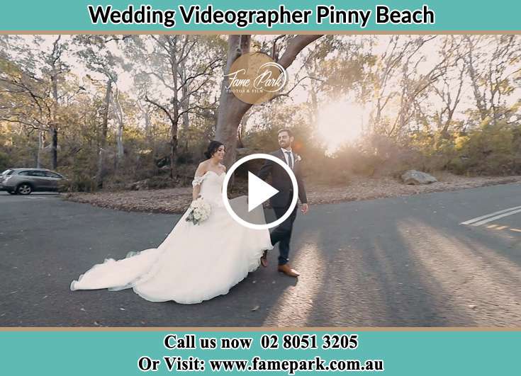 The Groom and the Bride walking in the street Pinny Beach NSW 2281