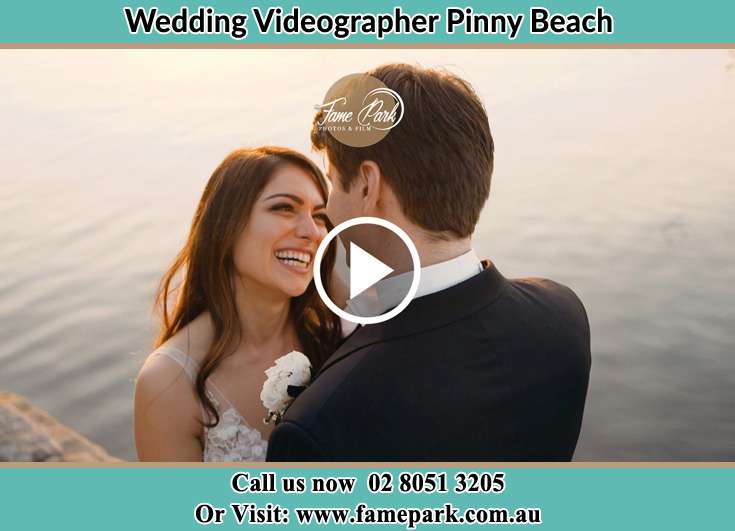 The newly weds looking at each other at the shore Pinny Beach NSW 2281