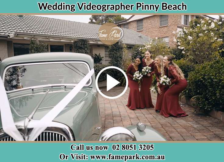 The bridesmaids near the wedding car Pinny Beach NSW 2281