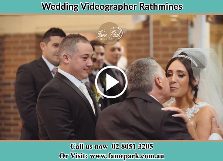 The Bride kiss by her father and the Groom waiting at the altar Rathmines NSW 2283