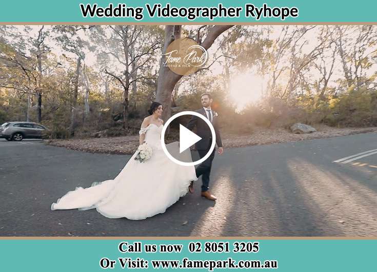 The Groom and the Bride walking in the street Ryhope NSW 2283