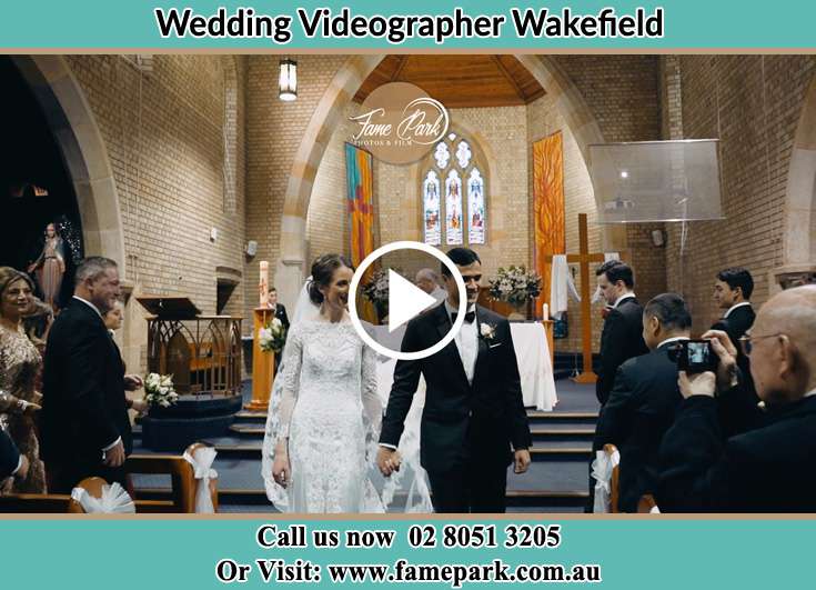 The newly weds walking through the well wishers Wakefield NSW 2278