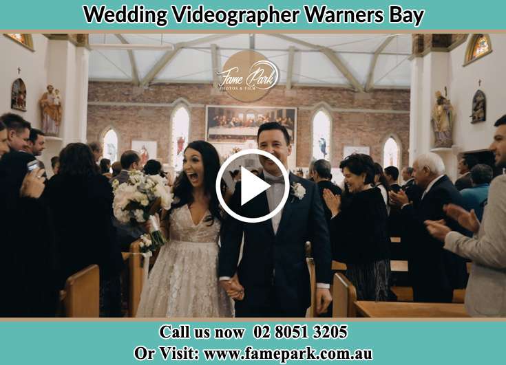 The newly weds walking through the well wishers Warners Bay NSW 2282