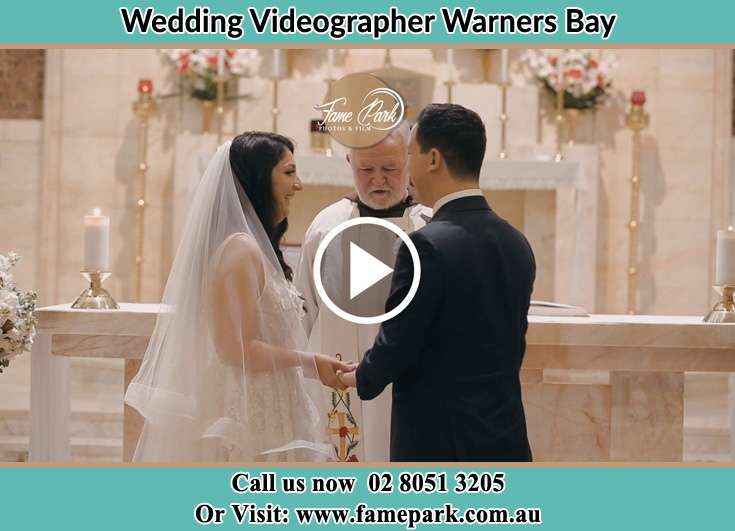 Bride and Groom at the altar with the Priest Warners Bay NSW 2282